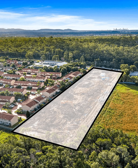 Urban expansion near wooded landscape