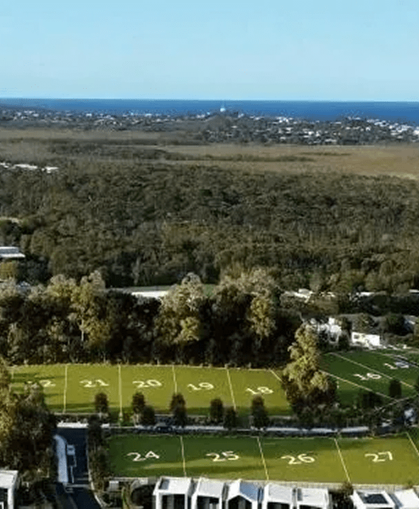 Numbered fields near forest and ocean