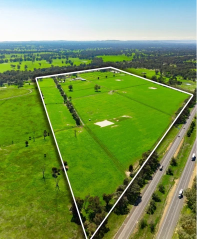Vast green field with boundary lines